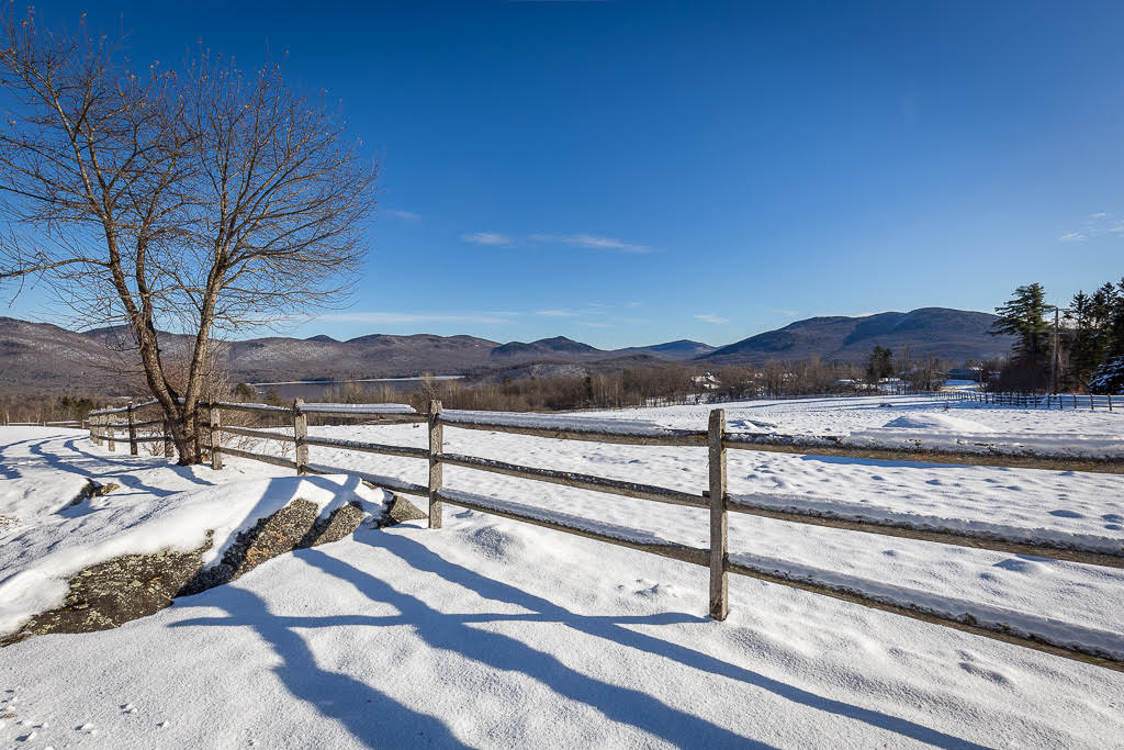 Split-rail fence overlooking Chittenden Reservoir and the Green Mountains
