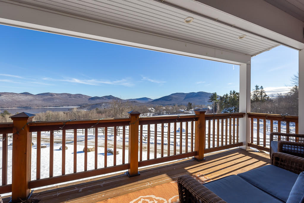 Covered porch with mountain views over the snowy pasture in winter