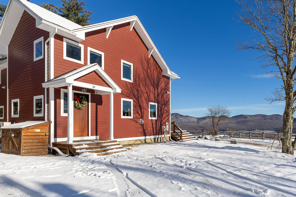 Side entry with welcoming wreath and mountain views